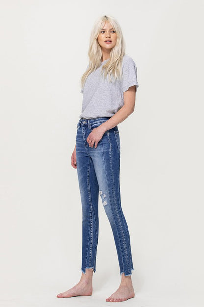 HIGH RISE ANKLE SKINNY W UNEVEN HEM DETAIL