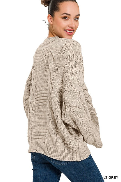 OVERSIZED BELL SLEEVE CABLE KNIT SWEATER